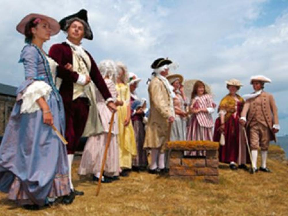 people dressed in clothing from the 18th century.
